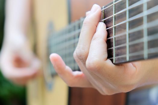 Close up image of Man playing his guitar Background
