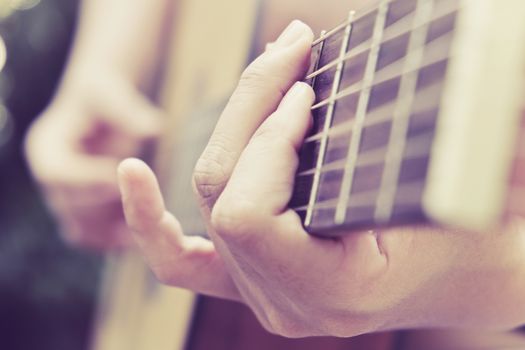 Close up image of Man playing his guitar Background