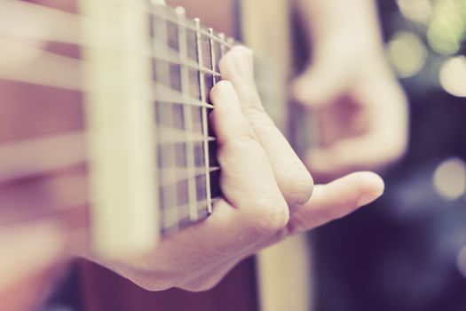 Close up image of Man playing his guitar Background