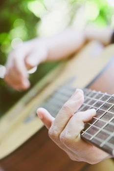 Close up image of Man playing his guitar Background