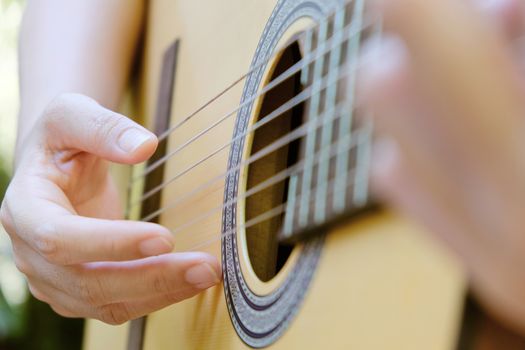 image of Man playing his acoustic guitar Background