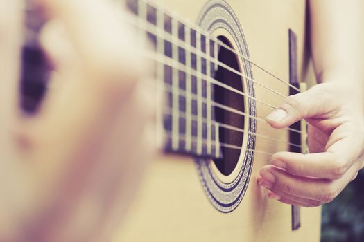 image of Man playing his acoustic guitar Background