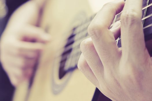 image of Man playing his acoustic guitar Background