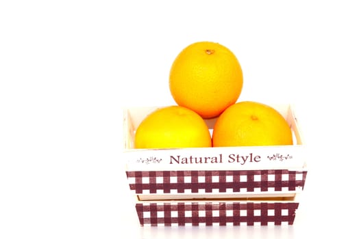 Orange fruit in white bowl on white background .