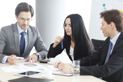 Business people discussing financial reports during a meeting