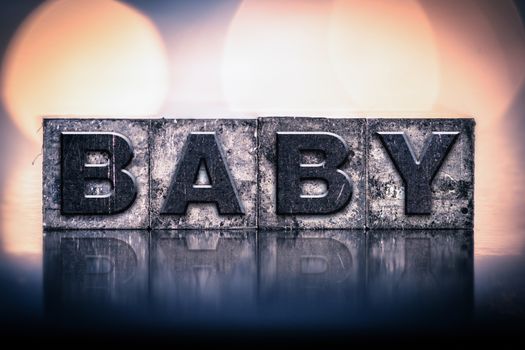 The word "BABY" written in vintage ink stained letterpress type.