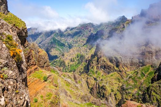 Hiking trail passage from mountain Pico Arieiro to Pico Ruivo, Madeira - colorful volcanic mountain landscape