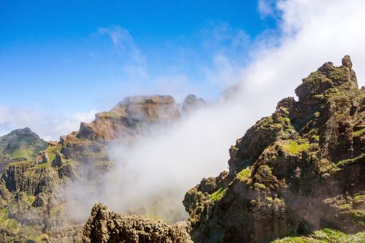 Hiking trail passage from mountain Pico Arieiro to Pico Ruivo, Madeira - colorful volcanic mountain landscape