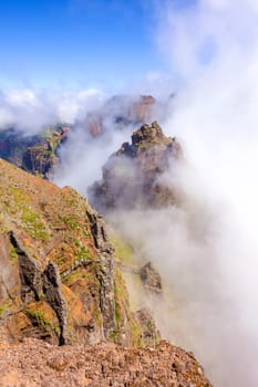 Colorful volcanic mountain landscape covered by clouds - Pico do Arieiro, Madeira, Portugal