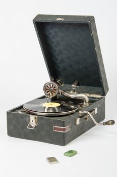 Old gramophone, a mechanical device for playing phonograph records, isolated on a white background