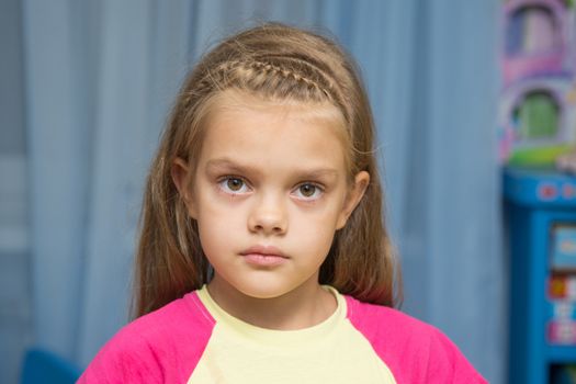 Five-year girl is upset in the nursery calmed down after crying