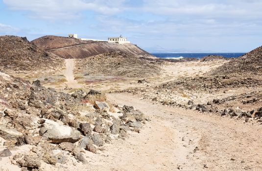 Faro de Punta Martiño or  Punta Martino lighthouse on the island of Lobos or Wolves Island, situated two kilometres north of the island of Fuerteventura, Canary Islands, Spain.