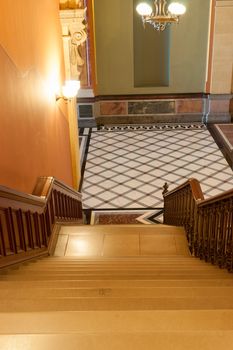 Stairs leading down to tiles diamond pattern floor in French Renaisance style, itterior of Illinois State Capital Building in Springfield.