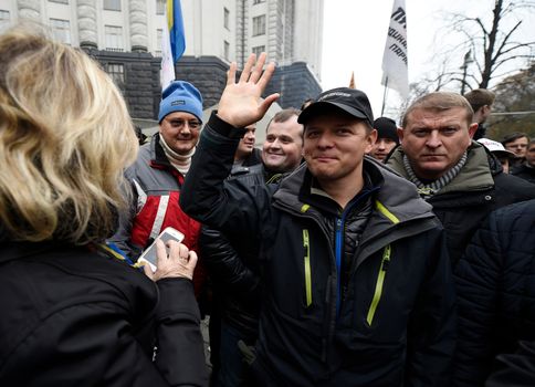 UKRAINE, Kiev: Radical Party leader Oleh Lyashko greets demonstrators at a protest outside the Cabinet of Ministers in Kiev, Ukraine on November 7, 2015, more than two weeks after an encampment was set up there as part of the tariff Maidan movement. The demonstrations call on the government to establish fair utility tariffs for Ukraine, considered too high by protesters; along with the resignation of the president, prime minister, and cabinet of ministers.