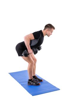 Young man shows finishing position of Standing Bent Over Dumbbells Row workout, isolated on white
