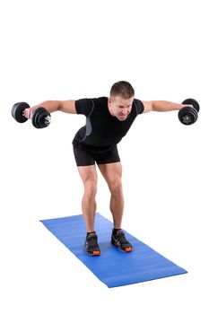 Young man shows finishing position of Standing Bent Over Dumbbell Reverse Fly workout, isolated on white