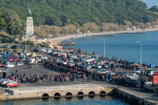 GREECE, Mytilene: Refugees wait to depart from Mytilene, the capital and port city of the Greek island of Lesbos, on November 7, 2015. From there, thousands of refugees will make their way to the Port of Piraeus.