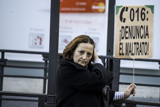 SPAIN, Madrid: A woman holds a sign that reads denounce abuse as thousands of protesters from across Spain march through Madrid on November 7, 2015 in a rally against gender violence. In Spain, more than 1,390 women have reportedly been murdered by male attackers since 1995; this year, 84 cases involving the murder of women by men have been reported thus far.