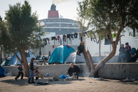 GREECE, Mytilene: Refugees wait to depart from Mytilene, the capital and port city of the Greek island of Lesbos, on November 7, 2015. From there, thousands of refugees will make their way to the Port of Piraeus.