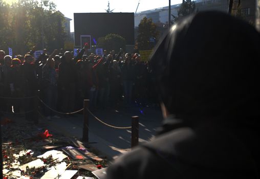 TURKEY, Ankara: Mourners raise their fists in the air at a ceremony in Ankara, Turkey on November 7, 2015, honoring the victims of the twin explosions that left at least 97 people dead and more than 400 others injured on October 10.
