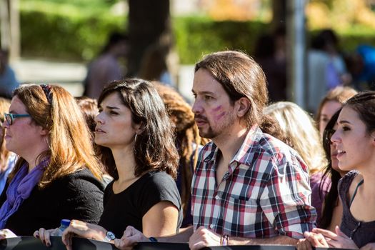 SPAIN, Madrid: Pablo Iglesias, leader of the Podemos Party, marches through Madrid with thousands of protesters from across Spain on November 7, 2015 in a rally against gender violence. In Spain, more than 1,390 women have reportedly been murdered by male attackers since 1995; this year, 84 cases involving the murder of women by men have been reported thus far. 