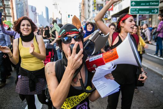 SPAIN, Madrid: A woman calls out on a bullhorn as thousands of protesters from across Spain march through Madrid on November 7, 2015 in a rally against gender violence. In Spain, more than 1,390 women have reportedly been murdered by male attackers since 1995; this year, 84 cases involving the murder of women by men have been reported thus far. 