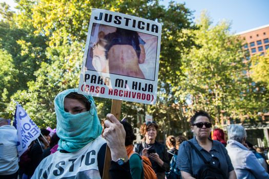 SPAIN, Madrid: A protester raises a sign as thousands from across Spain march through Madrid on November 7, 2015 in a rally against gender violence. In Spain, more than 1,390 women have reportedly been murdered by male attackers since 1995; this year, 84 cases involving the murder of women by men have been reported thus far. 