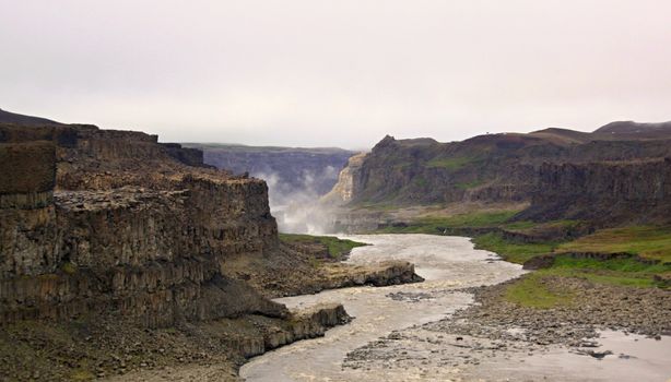The river and waterfall on background,Iceland