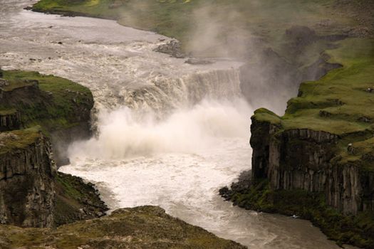 The big waterfall and river canyon in Icelands national park