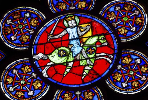 Armed Knight Sword Stained Glass Notre Dame Cathedral Paris France.  Notre Dame was built between 1163 and 1250AD.  