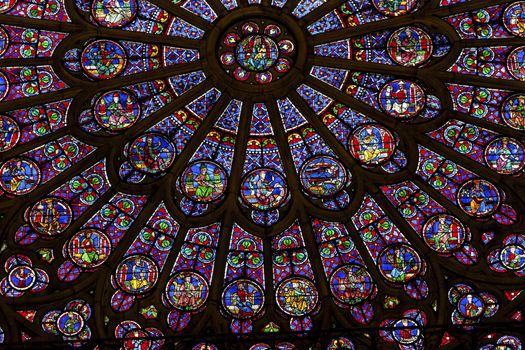 North Rose Window Virgin Mary Jesus Disciples Stained Glass Notre Dame Cathedral Paris France.  Notre Dame was built between 1163 and 1250 AD.  Virgin Mary Rose Window oldest in Notre Dame from 1250.