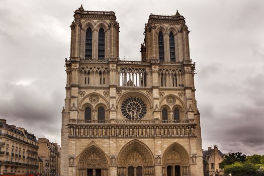Facade Overcast Skies Notre Dame Cathedral Paris France.  Notre Dame was built between 1163 and 1250AD.  