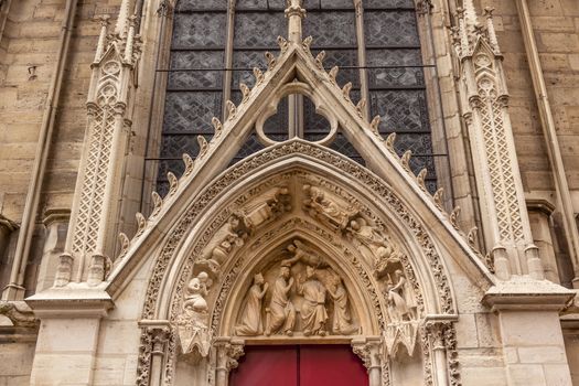 Biblical Statues Little Red Door Notre Dame Cathedral Paris France.  Notre Dame was built between 1163 and 1250AD.  
