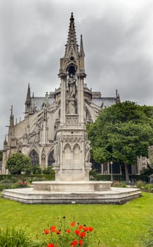 Rear Back Garden Overcast Skies Flying Buttresses Notre Dame Cathedral Paris France.  Notre Dame was built between 1163 and 1250AD.  