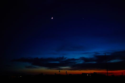 Silhouettes of houses in the sunset in Africa