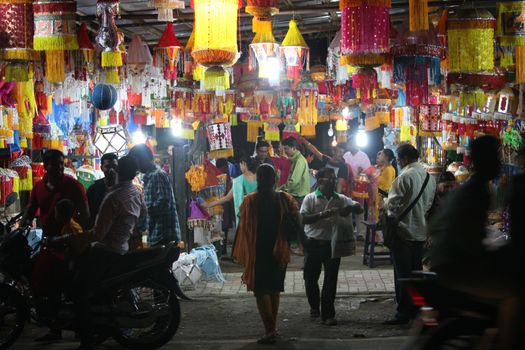 Pune, India - November 7, 2015: People in India shopping for sky lanterns on the occasion of Diwali festival in India