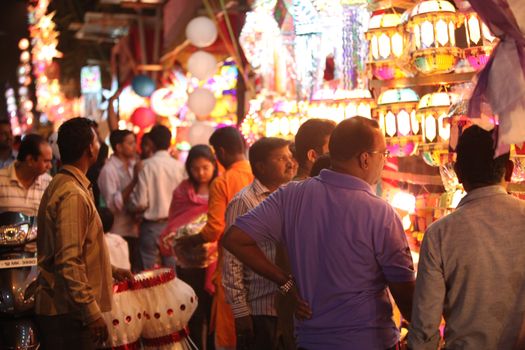 Pune, India - November 7, 2015: People in India shopping for sky lanterns on the occasion of Diwali festival in India