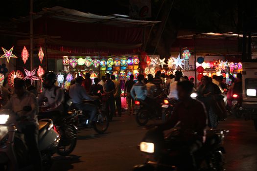 Pune, India - November 7, 2015: People in India shopping for sky lanterns on the occasion of Diwali festival in India