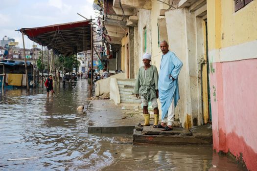 EGYPT, Alexandria: People are seen in the flooding road after a torrential rain caused flood in the Kafr El Arab neigborhood in west of Alexandria, Egypt on November 07, 2015.