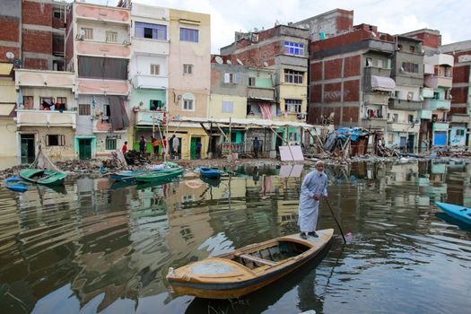 EGYPT, Alexandria: People are seen in the flooding road after a torrential rain caused flood in the Kafr El Arab neigborhood in west of Alexandria, Egypt on November 07, 2015.