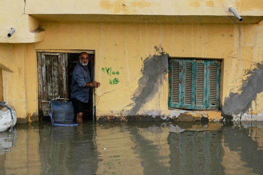 EGYPT, Alexandria: People are seen in the flooding road after a torrential rain caused flood in the Kafr El Arab neigborhood in west of Alexandria, Egypt on November 07, 2015.