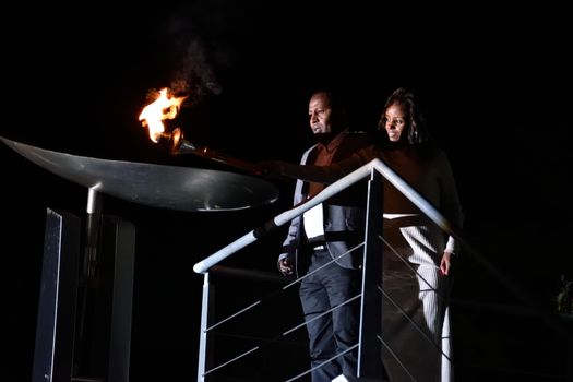 GREECE, Athens: Mare Dibaba, winner of the 2015 marathon at the world championships in Beijing, lights the altar during the Ceremony of the Lighting of the Marathon Flame at the Marathon Tomb in Athens, Greece, on November 7, 2015.