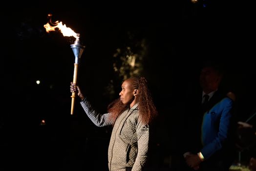 GREECE, Athens: Long-distance runner Gladys Cherono raises the Marathon flame Torch during the Ceremony of the Lighting of the Marathon Flame at the Marathon Tomb in Athens, Greece, on November 7, 2015.