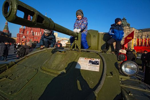 RUSSIA, Moscow: Children are seen on a tank on the Red Square during a parade in commemoration of the historical 1941 military parade in Moscow, Russia, on November 7, 2015. 
