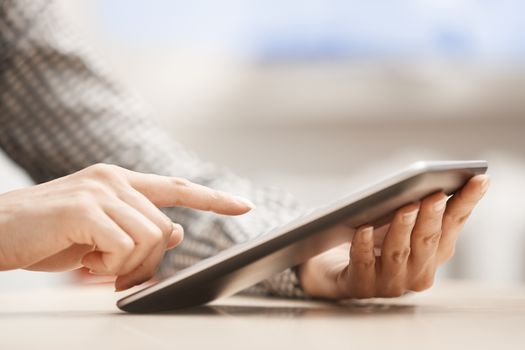 Businesswoman at office working with digital tablet