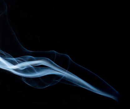 Movement of white smoke on black background