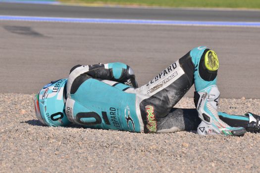 SPAIN, Cheste: Spanish pilot Efren Vasquez lays on the floor after a fall during Valencia Motor GP tournament at Ricardo Tormo circuit in Valencia, Spain on November 8, 2015.Miguel Oliveira won the race and Danny Kent took Moto3 title.