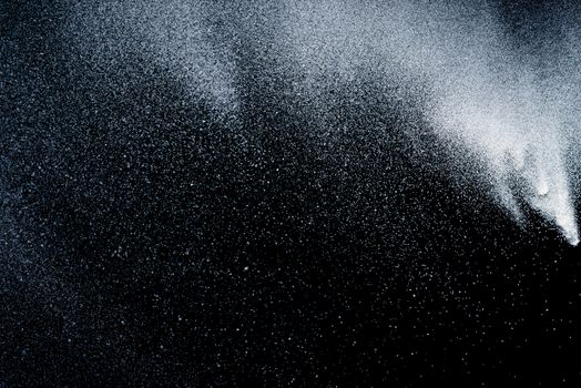 Freeze motion of dust on black background