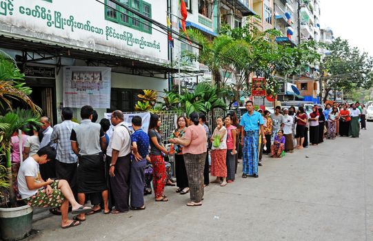 MYANMAR, Yangon: Voters line up in front of a polling station in Yangon, Myanmar, on November 8, 2015. Myanmar goes to the polls in an historic election that could thrust opposition leader Aung San Suu Kyi's pro-democracy party into power and pull the country away from the grip of the military. 