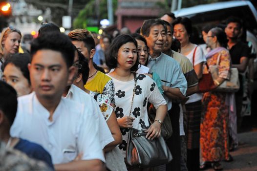MYANMAR, Yangon: Voters line up in front of a polling station in Yangon, Myanmar, on November 8, 2015. Myanmar goes to the polls in an historic election that could thrust opposition leader Aung San Suu Kyi's pro-democracy party into power and pull the country away from the grip of the military. 